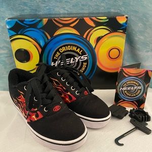 Heelys Pro 20 Red Flames- Boys Youth Size 2. Slightly/Gently Used. Worn Twice.